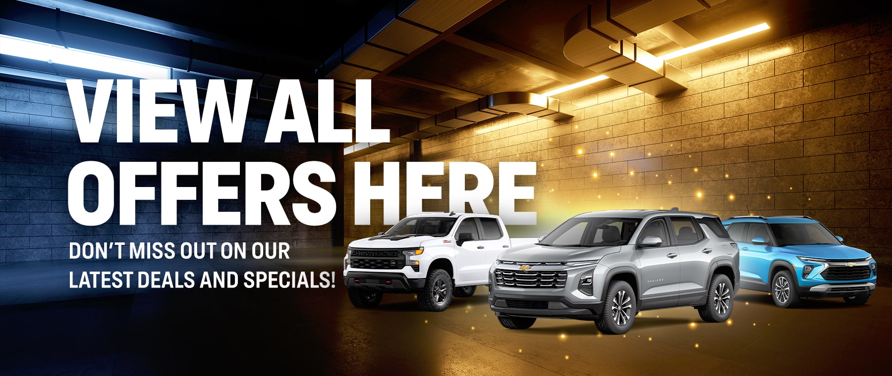 Three Chevrolet SUVs parked in a lit garage with text promoting deals and specials.