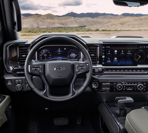Modern Chevrolet truck interior featuring a digital dashboard, steering wheel, and infotainment system.