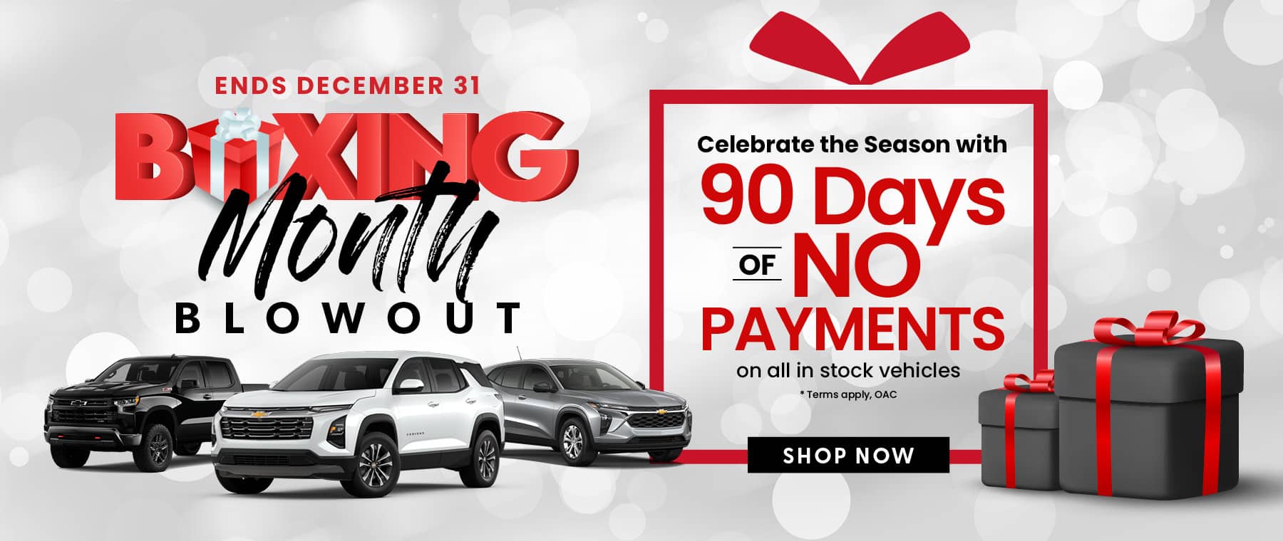 Boxing Month Blowout ad with SUVs. Ends Dec 31. Offer: 90 days no payments. Decorative gift boxes shown.