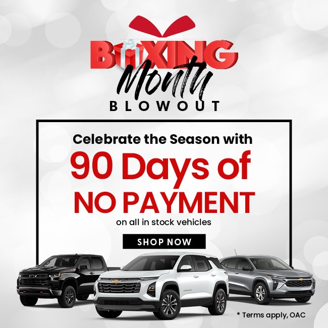 Boxing Month Blowout ad offering 90 days no payment on in-stock vehicles, featuring three cars.