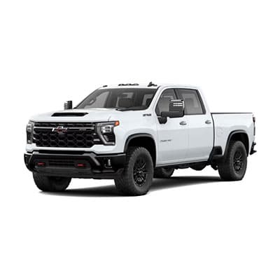 Silver pickup truck viewed from the front-right angle on a white background. The truck features a large grille, chrome accents, and extended side mirrors. It has a robust and modern design with visible details like headlights and wheels.